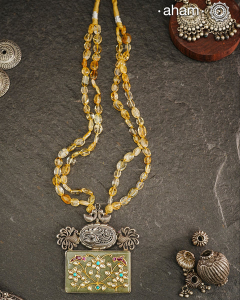 Handmade pendant with Mughal Inspired intricate floral inlay work in semi precious stone setting. Comes with semi precious stone beads A piece so timeless that it can we worn across generations.