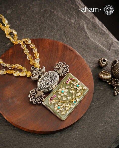 Handmade pendant with Mughal Inspired intricate floral inlay work in semi precious stone setting. Comes with semi precious stone beads A piece so timeless that it can we worn across generations.