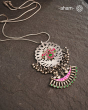One of a kind neckpiece with a cutwork pendant, ghungroos, and beautiful kundan highlight. Comes with a long chain. Crafted in silver.