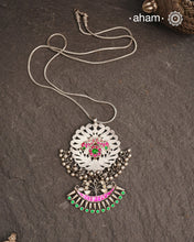 One of a kind neckpiece with a cutwork pendant, ghungroos, and beautiful kundan highlight. Comes with a long chain. Crafted in silver.