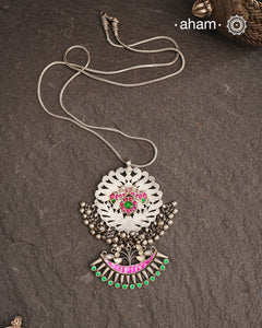 One of a kind neckpiece with a cutwork pendant, ghungroos, and beautiful kundan highlight. Comes with a long chain. Crafted in silver.