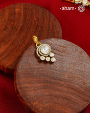 Brilliant moissanites come together in a graceful arrangement to create this elegant pendant. Crafted in 92.5 silver with a rich gold polish, it offers exceptional sparkle and timeless versatility. A beautiful choice for everyday celebrations.