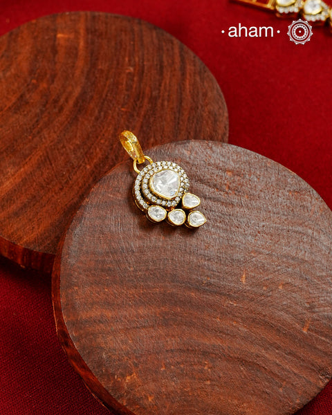 Brilliant moissanites come together in a graceful arrangement to create this elegant pendant. Crafted in 92.5 silver with a rich gold polish, it offers exceptional sparkle and timeless versatility. A beautiful choice for everyday celebrations.