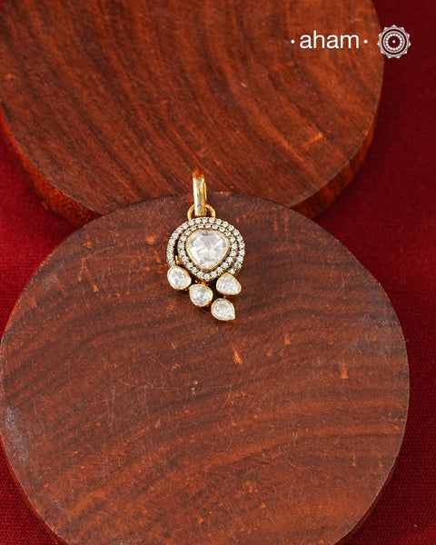 Brilliant moissanites come together in a graceful arrangement to create this elegant pendant. Crafted in 92.5 silver with a rich gold polish, it offers exceptional sparkle and timeless versatility. A beautiful choice for everyday celebrations.
