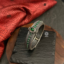 Mewad kada with beautiful Rava and green stone highlights.Handcrafted in 92.5 sterling silver in Rajasthan. Everyday staple pieces which can be teamed with any outfit of your choice.