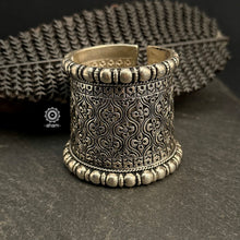 The Mewad Silver Handcuff (Open Cuff) features classic Chitai work from Rajasthan, meticulously crafted in 92.5% sterling silver. The cuff is adorned entirely with Chitai work, known for its intricate and detailed engraving, merging traditional artistry with contemporary style.