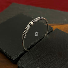 Handcrafted twist and wear textured kada in 92.5 sterling silver.