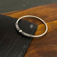 Handcrafted twist and wear textured kada in 92.5 sterling silver.