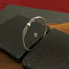 Handcrafted twist and wear textured kada in 92.5 sterling silver.