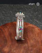 Handcrafted 92.5 silver kada with beautiful tar work and Turquoise &amp; Kemp stones embellishments. The price is for one piece kada only.