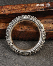 Mewad kada with beautiful rava and tar work.
Handcrafted in 92.5 sterling silver. Statement pieces which are a must have in every jewellery lovers collection.