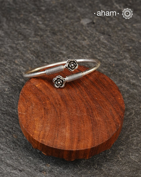 Handcrafted twist and wear bracelets in 92.5 sterling silver with beautiful flower motifs. Statement accessory which look great paired with your watches or even by itself.
