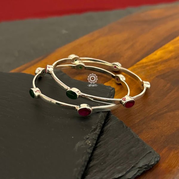 Handcrafted Summer Love bangles in 92.5 sterling silver with coloured stone highlights. Perfect everyday wear you can stack them or wear them alone.  Comes in a pair (2 bangles)