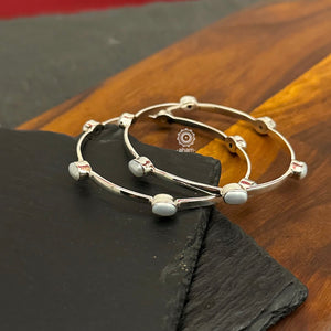 Handcrafted Summer Love bangles in 92.5 sterling silver with pearl highlights. Perfect everyday wear you can stack them or wear them alone.  Comes in a pair (2 bangles)