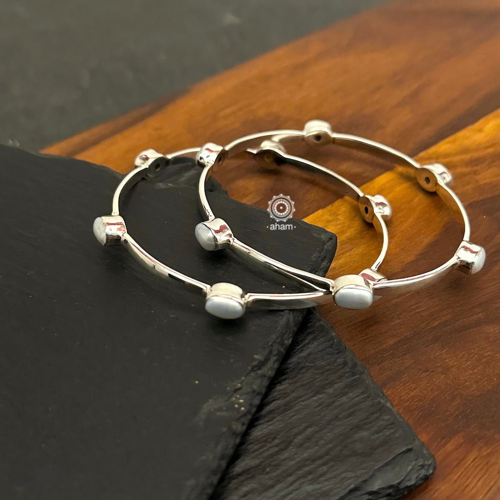 Handcrafted Summer Love bangles in 92.5 sterling silver with pearl highlights. Perfect everyday wear you can stack them or wear them alone.  Comes in a pair (2 bangles)