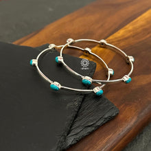 Handcrafted Summer Love bangles in 92.5 sterling silver with turquoise coloured stone highlights. Perfect everyday wear you can stack them or wear them alone.  Comes in a pair (2 bangles)