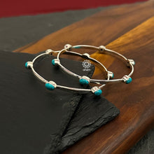 Handcrafted Summer Love bangles in 92.5 sterling silver with turquoise coloured stone highlights. Perfect everyday wear you can stack them or wear them alone.  Comes in a pair (2 bangles)