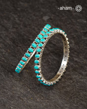 Handcrafted Summer Love bangles in 92.5 sterling silver with turquoise coloured stone highlights. Perfect everyday wear that you can stack them or wear them alone.