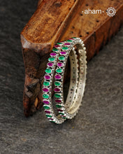 Handcrafted Summer Love bangles in 92.5 sterling silver with green and maroon coloured stone highlights. They look great with Indian clothes.
