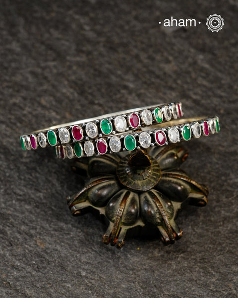Handcrafted Summer Love bangles in 92.5 sterling silver with green and maroon stone setting. Perfect for everyday wear, you can stack them or wear them alone.