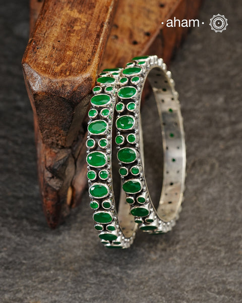 Handcrafted Summer Love bangles in 92.5 sterling silver with green kundan stone. You can choose to stack them or wear them alone.