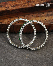 Handcrafted Summer Love bangles in 92.5 sterling silver with green kundan stone. You can choose to stack them or wear them alone.