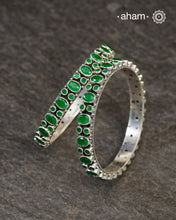 Handcrafted Summer Love bangles in 92.5 sterling silver with green kundan stone. You can choose to stack them or wear them alone.