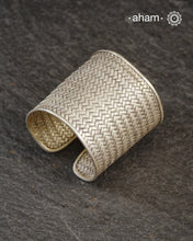 Statement 92.5 sterling silver handcuff with intricate weave pattern.
Sometimes all you need is one piece of accessory to make you feel powerful, and this is just that.