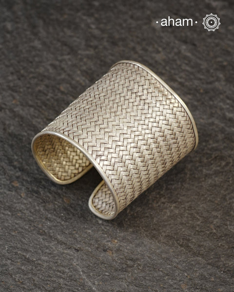 Statement 92.5 sterling silver handcuff with intricate weave pattern.
Sometimes all you need is one piece of accessory to make you feel powerful, and this is just that.