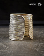 Statement 92.5 sterling silver handcuff with intricate weave pattern.
Sometimes all you need is one piece of accessory to make you feel powerful, and this is just that.