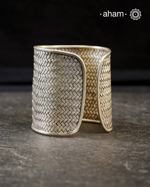 Statement 92.5 sterling silver handcuff with intricate weave pattern.
Sometimes all you need is one piece of accessory to make you feel powerful, and this is just that.