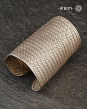 Statement and Adjustable 92.5 sterling silver handcuff with intricate weave pattern. Sometimes all you need is one piece of accessory to make you feel powerful, and this is just that.