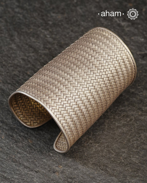 Statement and Adjustable 92.5 sterling silver handcuff with intricate weave pattern. Sometimes all you need is one piece of accessory to make you feel powerful, and this is just that.