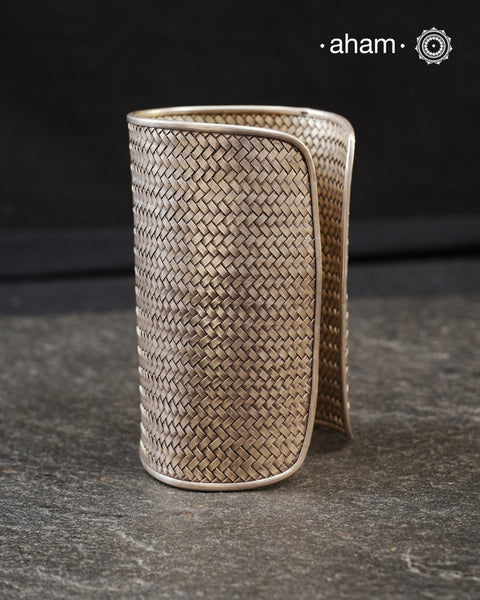 Statement  Adjustable 92.5 sterling silver handcuff with intricate weave pattern. Sometimes all you need is one piece of accessory to make you feel powerful, and this is just that.