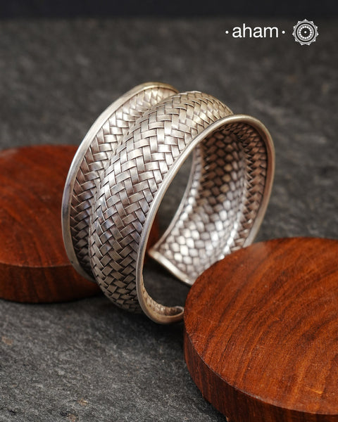 Statement Adjustable 92.5 sterling silver handcuff with intricate weave pattern.
Sometimes all you need is one piece of accessory to make you feel powerful, and this is just that.