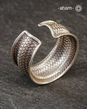 Statement Adjustable 92.5 sterling silver handcuff with intricate weave pattern.
Sometimes all you need is one piece of accessory to make you feel powerful, and this is just that.