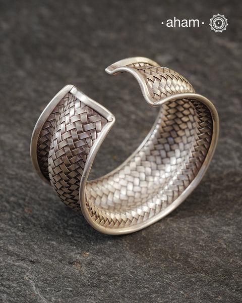 Statement Adjustable 92.5 sterling silver handcuff with intricate weave pattern.
Sometimes all you need is one piece of accessory to make you feel powerful, and this is just that.