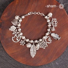 Up your wrist game with the A.M P.M Silver bracelet!
15 beautiful distinct charms all crafted in 92.5 silver come together to make this piece . Whether worn at day or night, this bracelet is Perfect for adding a playful touch to any outfit.

The price is for one piece only.