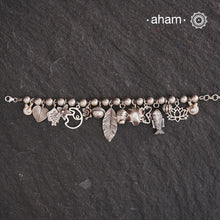 Up your wrist game with the A.M P.M Silver bracelet!
15 beautiful distinct charms all crafted in 92.5 silver come together to make this piece . Whether worn at day or night, this bracelet is Perfect for adding a playful touch to any outfit.

The price is for one piece only.