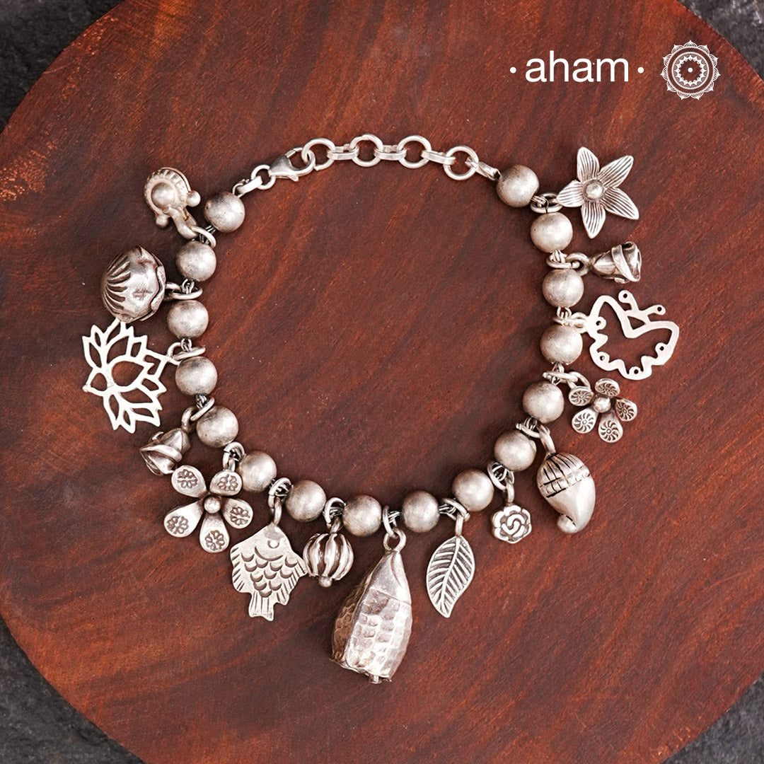 Up your wrist game with the A.M P.M Silver bracelet!
15 beautiful distinct charms all crafted in 92.5 silver come together to make this piece . Whether worn at day or night, this bracelet is Perfect for adding a playful touch to any outfit.

The price is for one piece only.