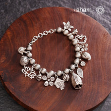 Up your wrist game with the A.M P.M Silver bracelet!
15 beautiful distinct charms all crafted in 92.5 silver come together to make this piece . Whether worn at day or night, this bracelet is Perfect for adding a playful touch to any outfit.

The price is for one piece only.