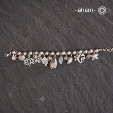 Up your wrist game with the A.M P.M Silver bracelet!
15 beautiful distinct charms all crafted in 92.5 silver come together to make this piece . Whether worn at day or night, this bracelet is Perfect for adding a playful touch to any outfit.

The price is for one piece only.