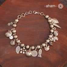 Up your wrist game with the A.M P.M Silver bracelet!
15 beautiful distinct charms all crafted in 92.5 silver come together to make this piece . Whether worn at day or night, this bracelet is Perfect for adding a playful touch to any outfit.