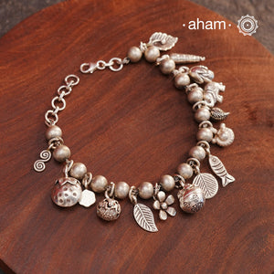 Up your wrist game with the A.M P.M Silver bracelet!
15 beautiful distinct charms all crafted in 92.5 silver come together to make this piece . Whether worn at day or night, this bracelet is Perfect for adding a playful touch to any outfit.