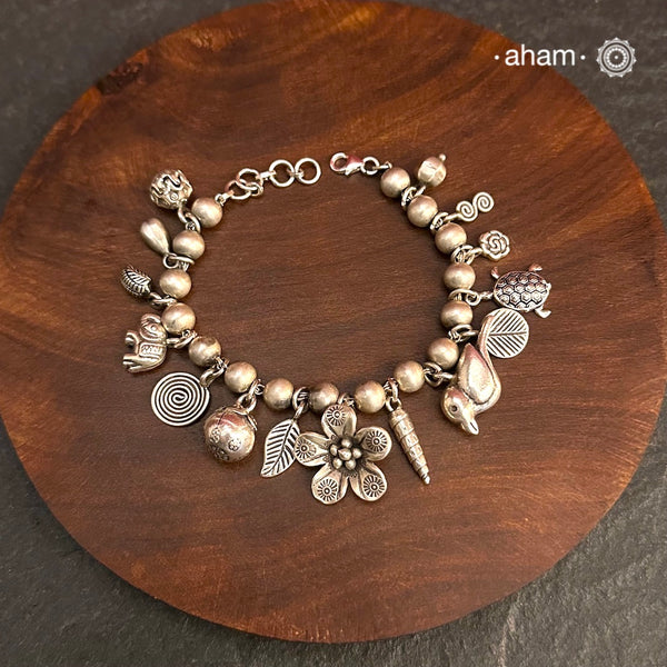 Up your wrist game with the A.M P.M Silver bracelet! 15 beautiful distinct charms all crafted in 92.5 silver come together to make this piece .
Whether worn at day or night, this bracelet is Perfect for adding a playful touch to any outfit. 
The price is for one piece only. 