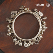 A beautiful A.M P.M Charm silver bangle Crafted in 92.5 silver with lots and lots of charms.
The price is for one piece only.