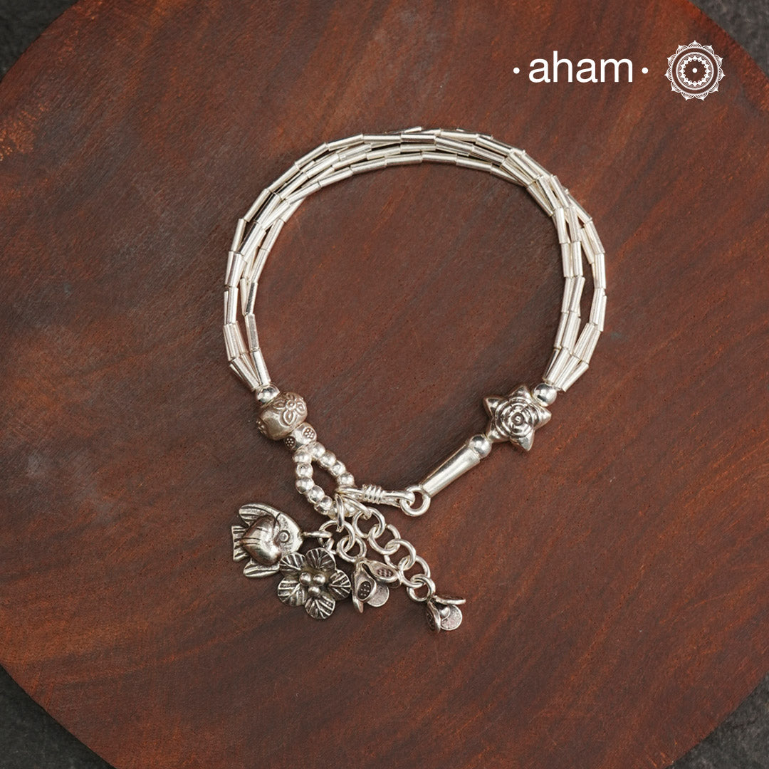 Up your wrist game with the A.M P.M Silver bracelet! Beautiful distinct charms all crafted in 92.5 silver come together to make this piece. Whether worn at day or night, this bracelet is perfect for adding a playful touch to any outfit.
The price is for one piece only.