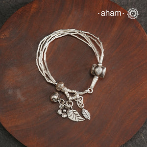 Up your wrist game with the A.M P.M Silver bracelet! Beautiful distinct charms all crafted in 92.5 silver come together to make this piece. Whether worn at day or night, this bracelet is perfect for adding a playful touch to any outfit.The price is for one piece only.