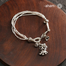 Up your wrist game with the A.M P.M Silver bracelet! Beautiful distinct charms all crafted in 92.5 silver come together to make this piece. Whether worn at day or night, this bracelet is perfect for adding a playful touch to any outfit.The price is for one piece only.