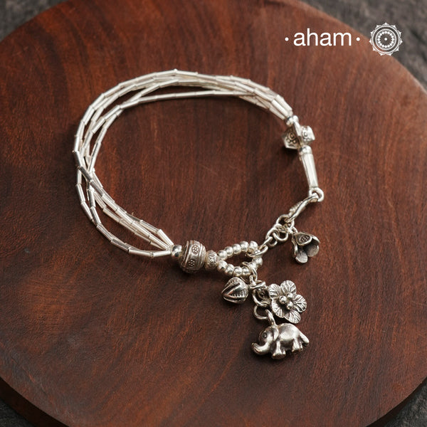 Up your wrist game with the A.M P.M Silver bracelet! Beautiful distinct charms all crafted in 92.5 silver come together to make this piece. Whether worn at day or night, this bracelet is perfect for adding a playful touch to any outfit.The price is for one piece only.